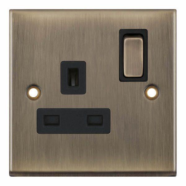 Selectric 13a Single Socket Antique Brass c/w Black Inserts 